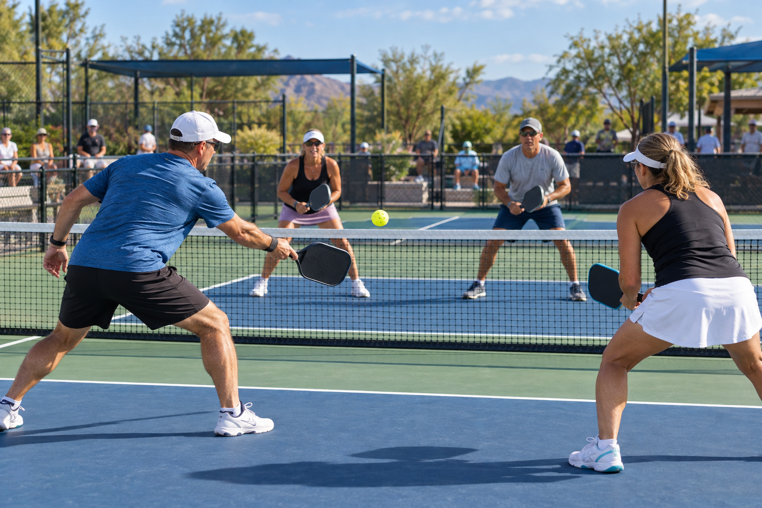 Players competing in a pickleball doubles rally